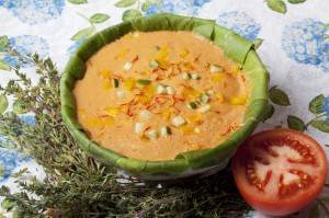 raw food soup with slices of orange in Souchon organic plate