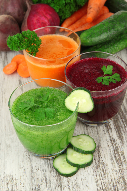 Fresh vegetable juices on table close-up
