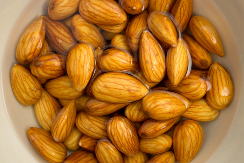 Closeup of almonds soaked in water