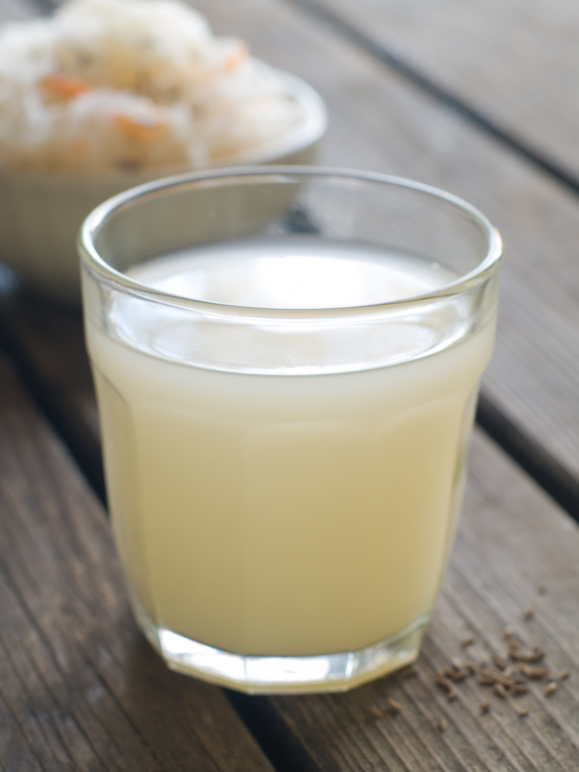 Sauerkraut drink in glass, selective focus