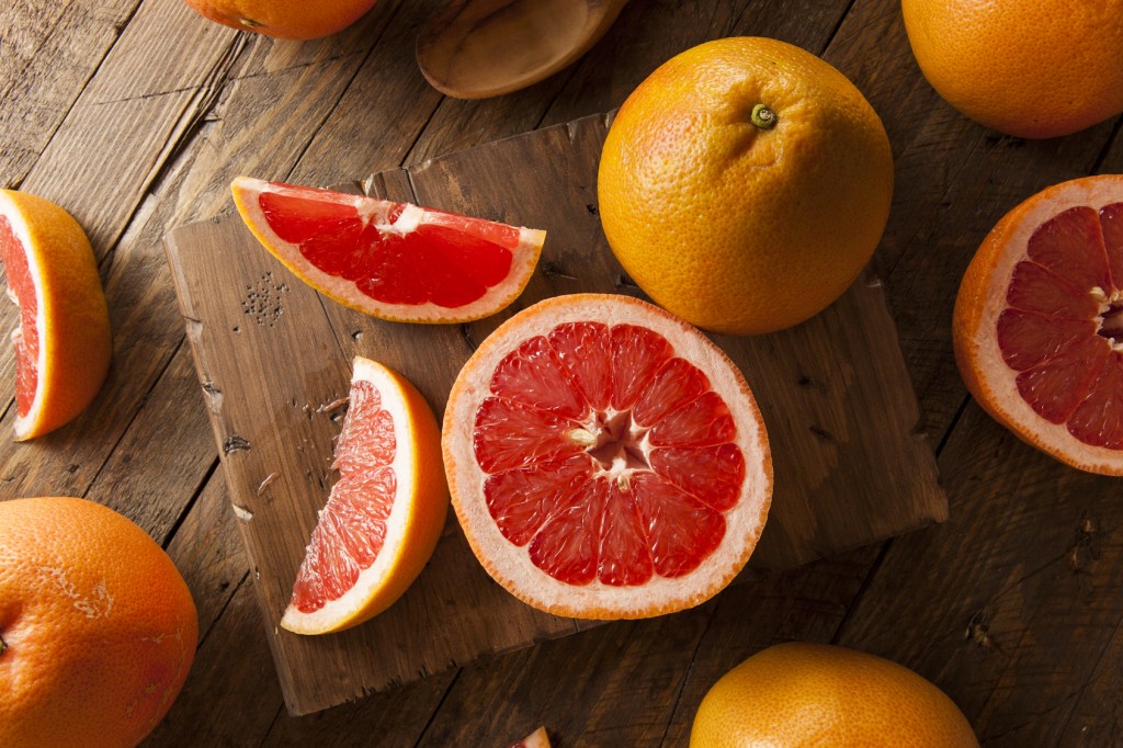 Healthy Organic Red Ruby Grapefruit on a Background